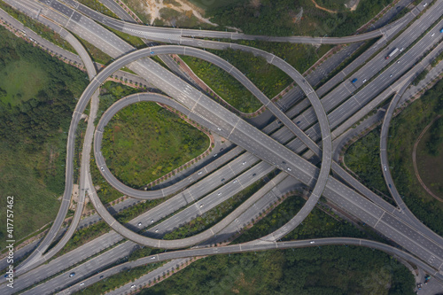 Top view of traffic flow on a large modern urban circular interchange	
