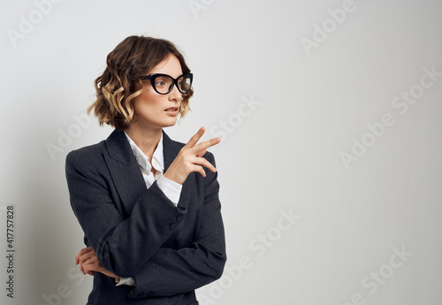 Woman in classic suit short haired glasses model business finance.