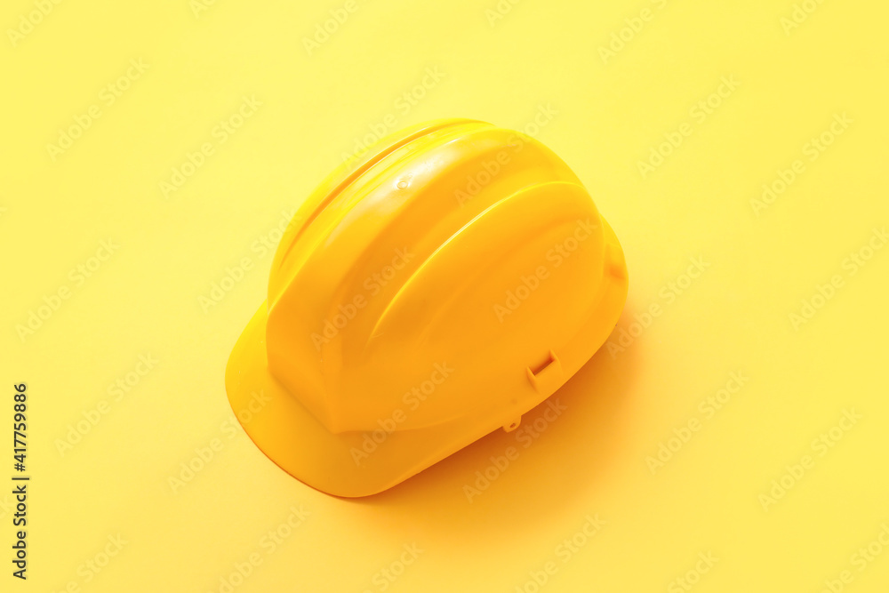 Fototapeta premium New hardhat on color background