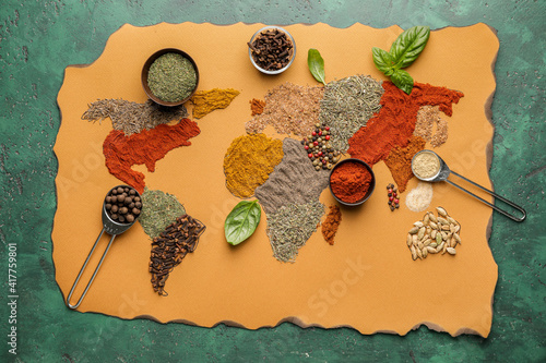 World map made of spices on color background
