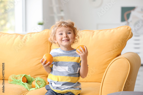Cute little boy with orange...
