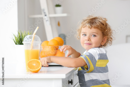 Cute little boy with laptop...