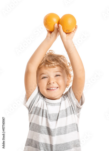 Cute little boy with orange...