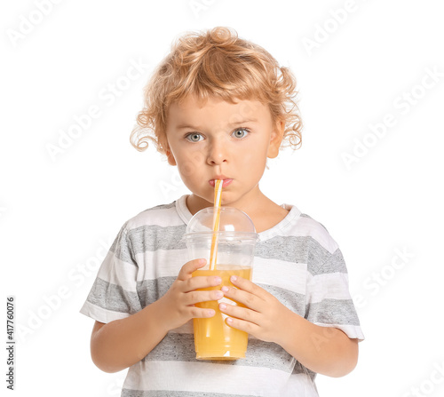 Cute little boy drinking or...