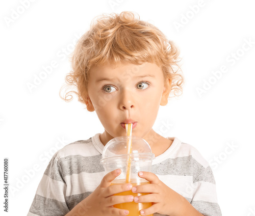 Cute little boy drinking or...