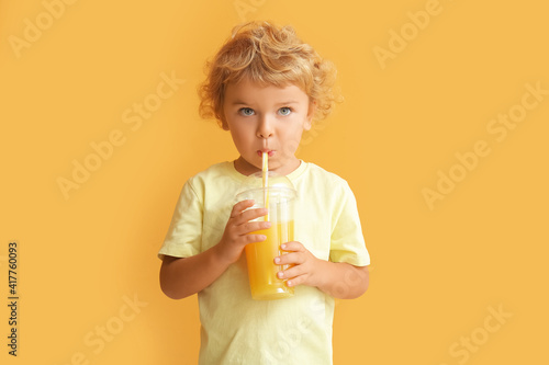Cute little boy drinking or...