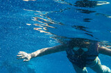 Girl is engaged in snorkeling in the sea
