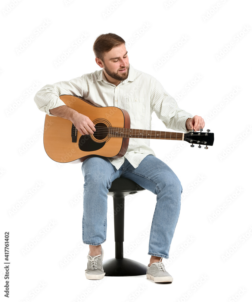 Young man playing guitar on white background Young man playing guitar on white background