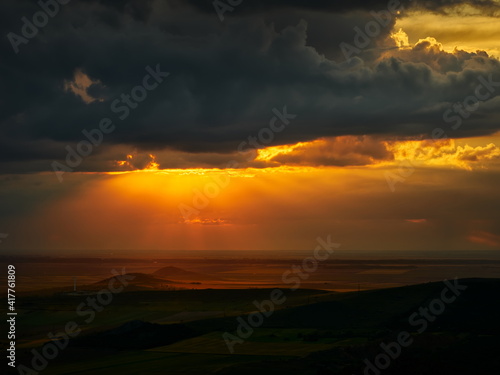 beautiful sunset with cloudy sky over the field in Dobrogea, Romania