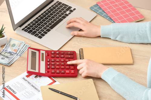 Woman with calculator and l...