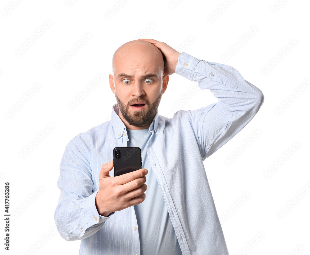 Shocked man with mobile phone on white background Shocked man with mobile phone on white background
