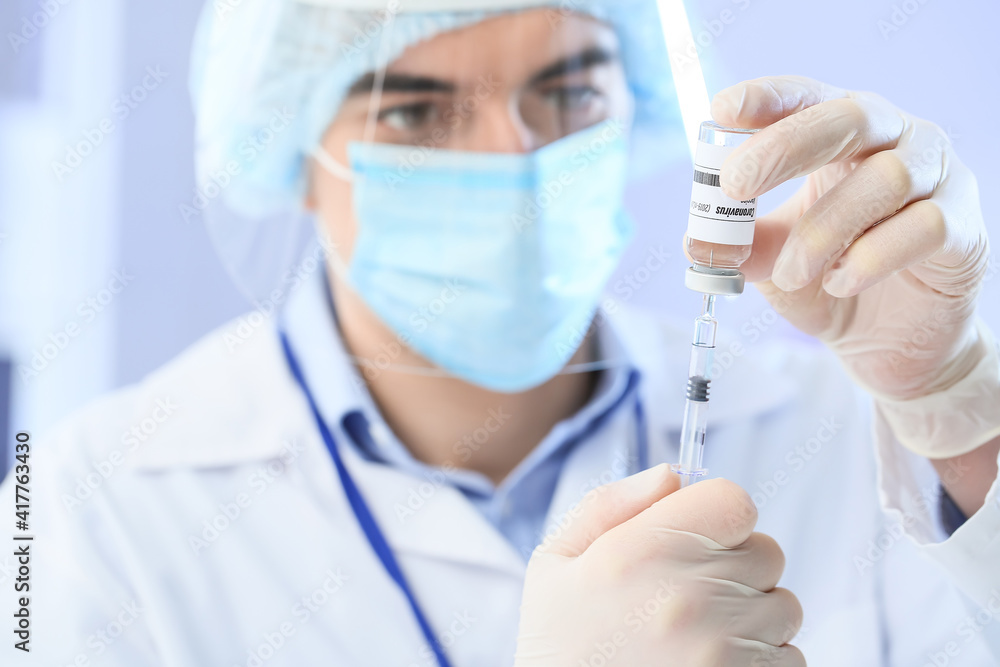 Scientist developing vaccine against COVID-19 in laboratory Scientist developing vaccine against COVID-19 in laboratory