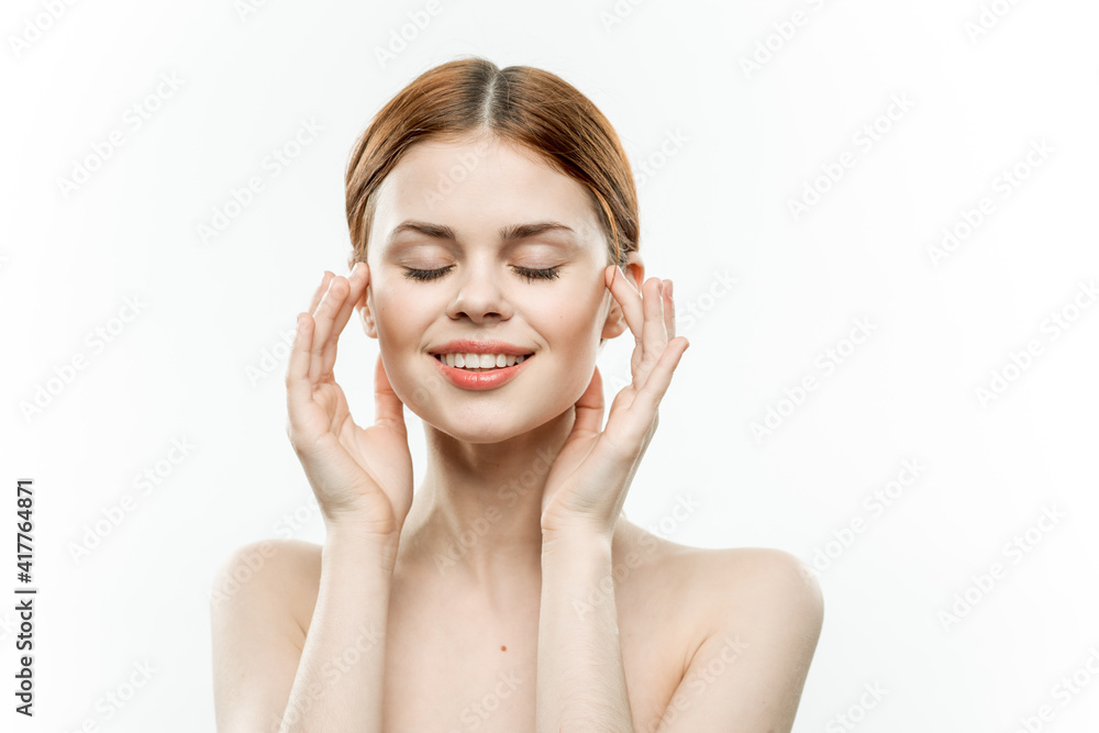 woman with closed eyes holding hands near face naked shoulders close-up emotions