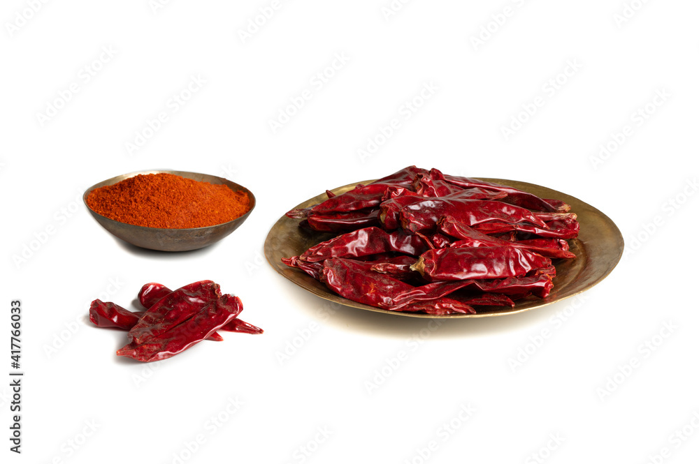 Dried Red Chili Peppers with Red Chili Powder isolated on White Background Dried Red Chili Peppers with Red Chili Powder isolated on White Background