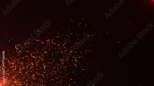 Burning sparks red hot fire on black background  UHD  Video Clip stock footage.