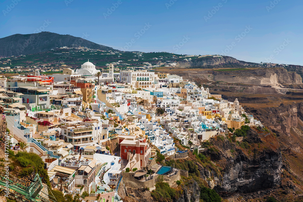 Top view of town Fira, urban landscape on a sunny summer day. Santorini, Greece