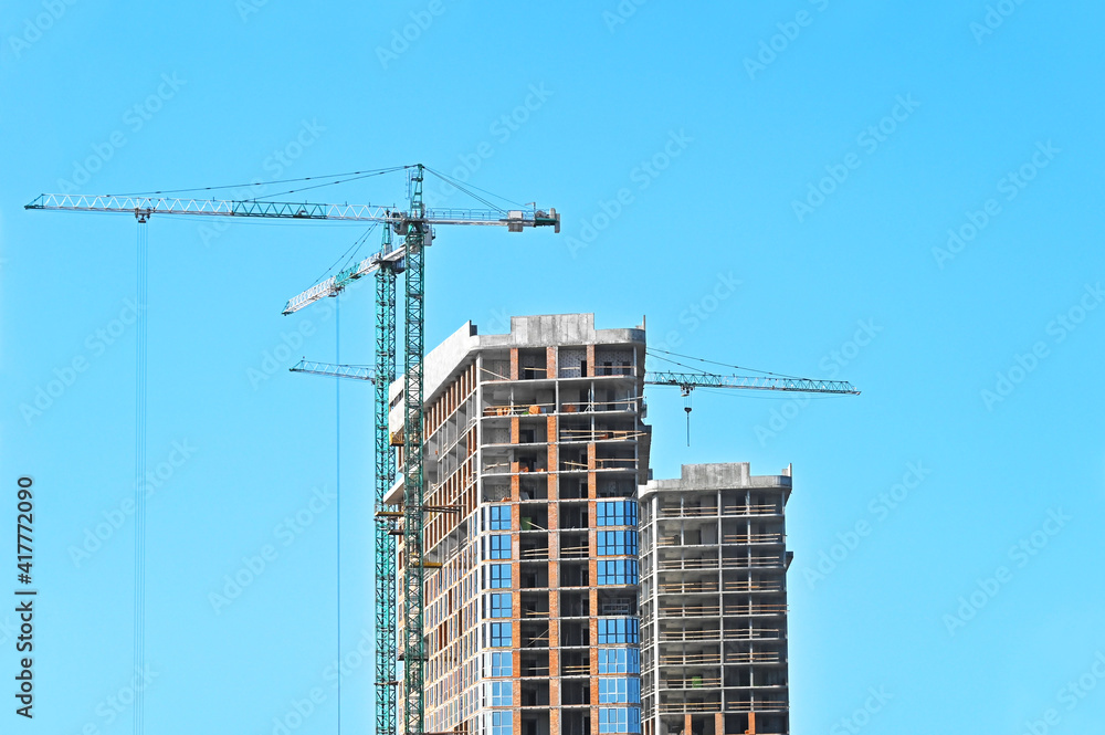 Crane and highrise construction site Crane and highrise construction site