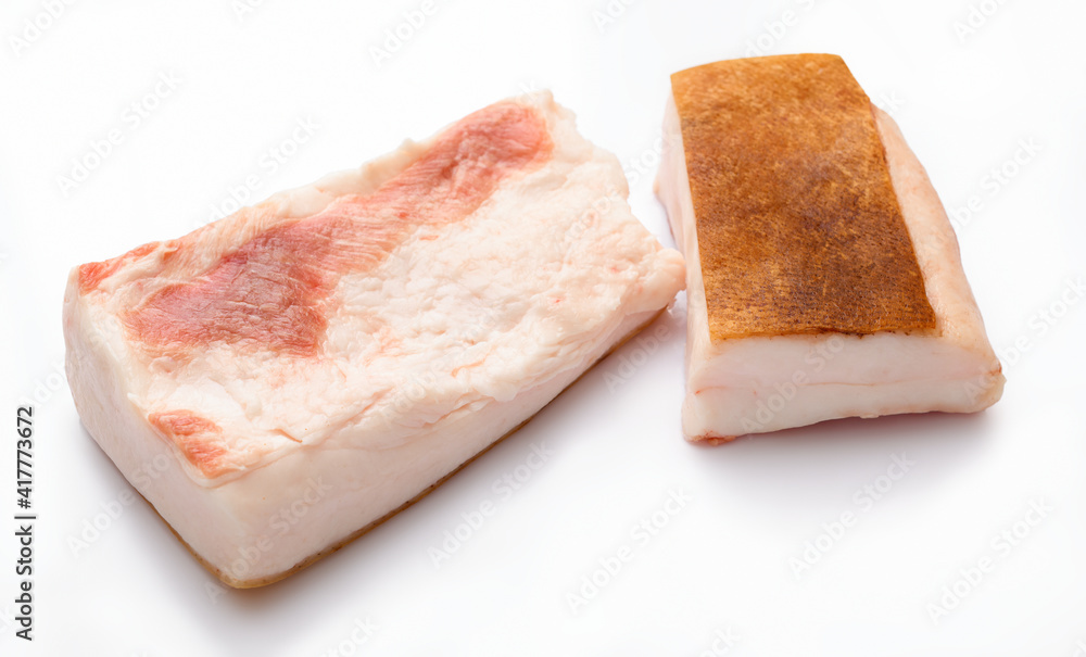 raw lard two pieces on white background, pork fat raw lard two pieces on white background, pork fat