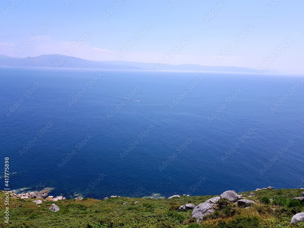 blue ocean with clean sky with a faded background in Fisterra Spain