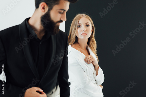 couple in love on date. business meeting fashion. formal fashion look. Proposal or engagement party. Formal couple of man in tuxedo and sexy woman. Bearded tuxedo man and woman. Always in style.