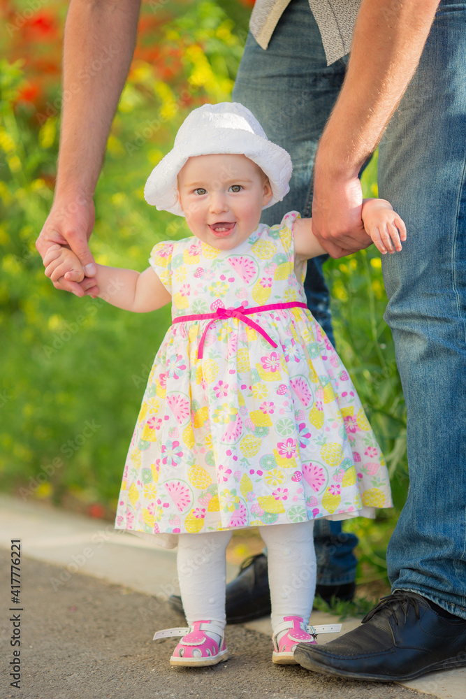 Portrait of a beautiful little girl having fun in field of flowers in spring. Portrait of a beautiful little girl having fun in field of flowers in spring.