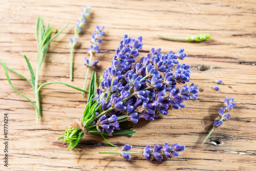 Bunch of lavandula or lavender flowers on the wooden background.