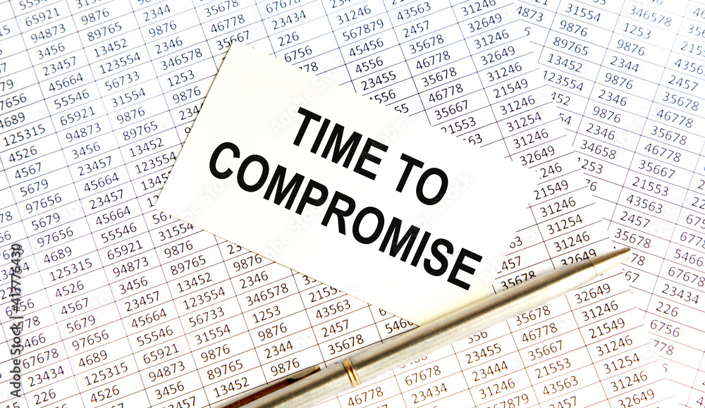 On the business card the text of Time to compromise, next to the pen, the background are reports. On the business card the text of Time to compromise, next to the pen, the background are reports.