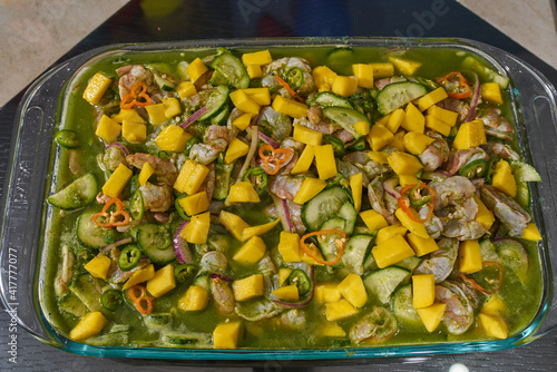 Aguachile con mango y habanero preparado en un refractario photo