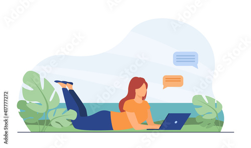 Woman chatting on laptop and lying on meadow. Computer, online, network flat vector illustration. Freelance and communication concept for banner, website design or landing web page