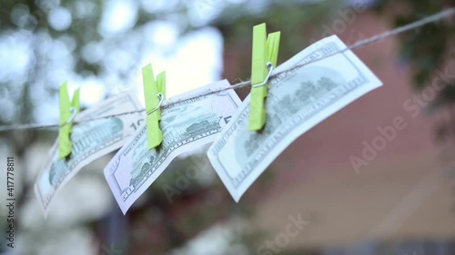 Dollars on a linen rope, the concept of money laundering.