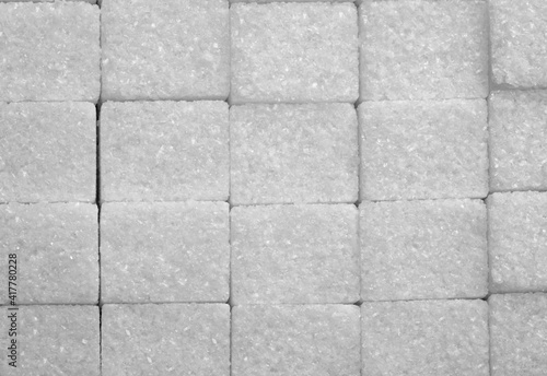 White sugar cubes arranged at the background