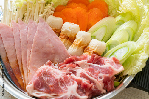 sukiyaki or shabu hot pot black soup with meat raw and vegetable