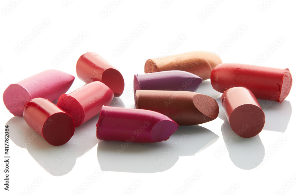 Multi-coloured scraps of lipstick on a mirror with reflexion Multi-coloured scraps of lipstick on a mirror with reflexion