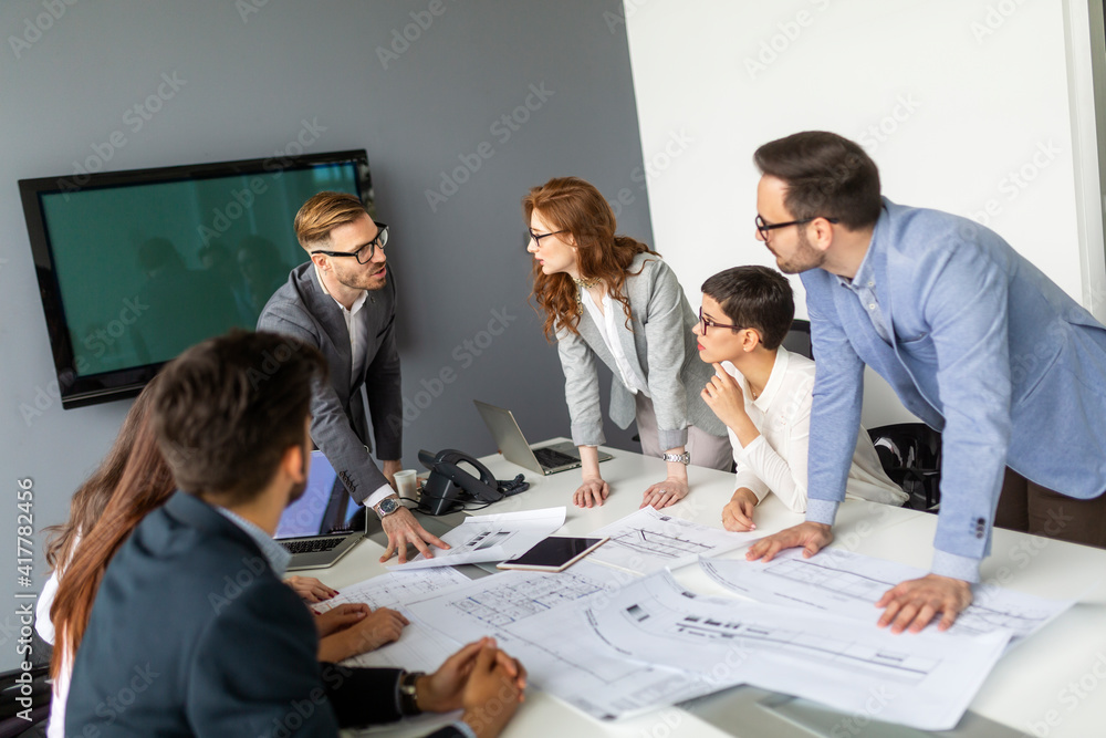 Fototapeta premium Business people having board meeting in modern office