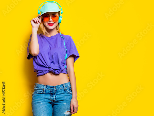 girl with orange glasses and headphones © Masson
