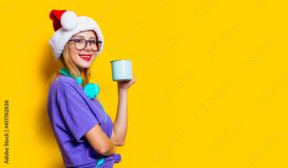 girl in Christmas hat with cup girl in Christmas hat with cup