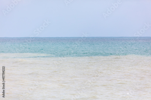 Fototapeta Naklejka Na Ścianę i Meble -  Muddy water in the blue sea