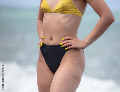 Girl in a swimsuit on the beach
