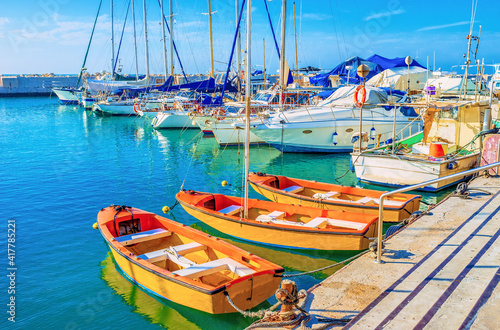 Three orange boats in small fishing port in Tel Aviv, Israel photo