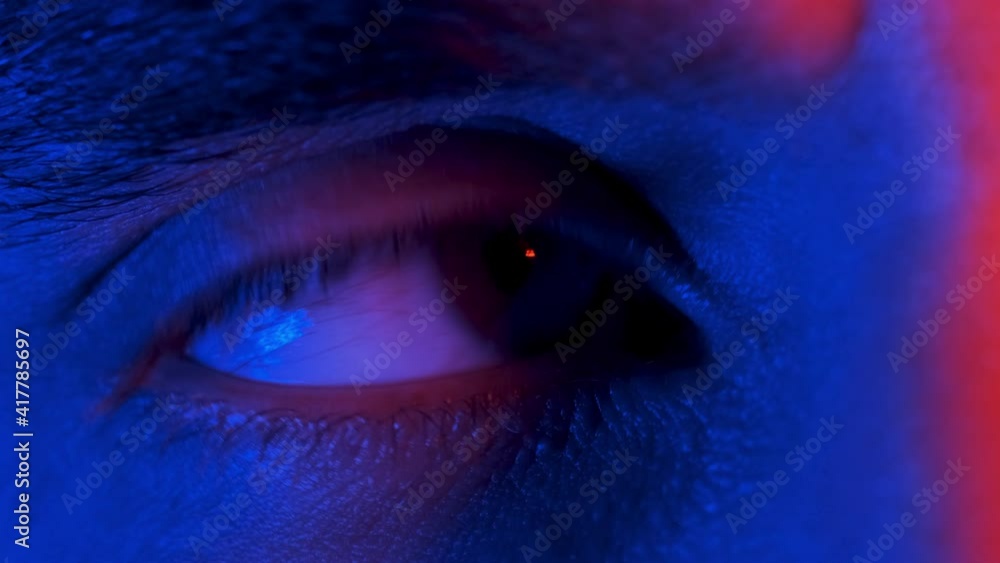 The close up macro view of man eye. slow motion The close up macro view of man eye. slow motion