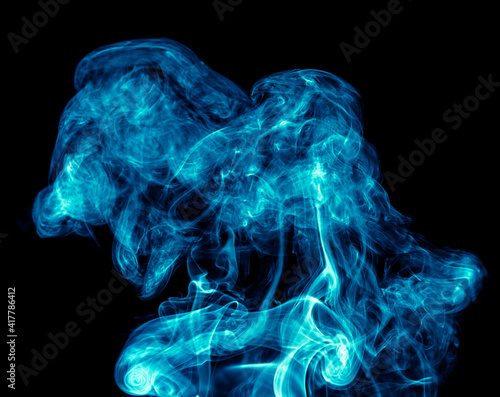 Blue smoke isolated on black background.