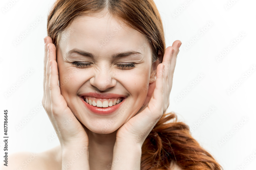 emotional cheerful woman holding hands near face attractive look emotional cheerful woman holding hands near face attractive look