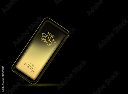 1kg gold bar isolated on a black background with clipping path photo