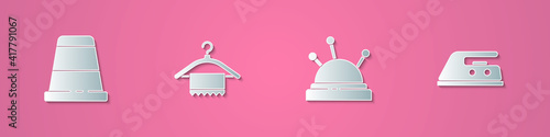 Set paper cut Thimble for sewing, Hanger wardrobe, Needle bed and needles and Electric iron icon. Paper art style. Vector.