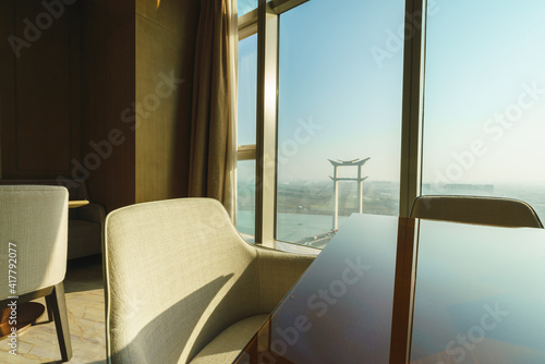 High-rise indoor dining table and Jinjiang Bridge in the sun at outdoors