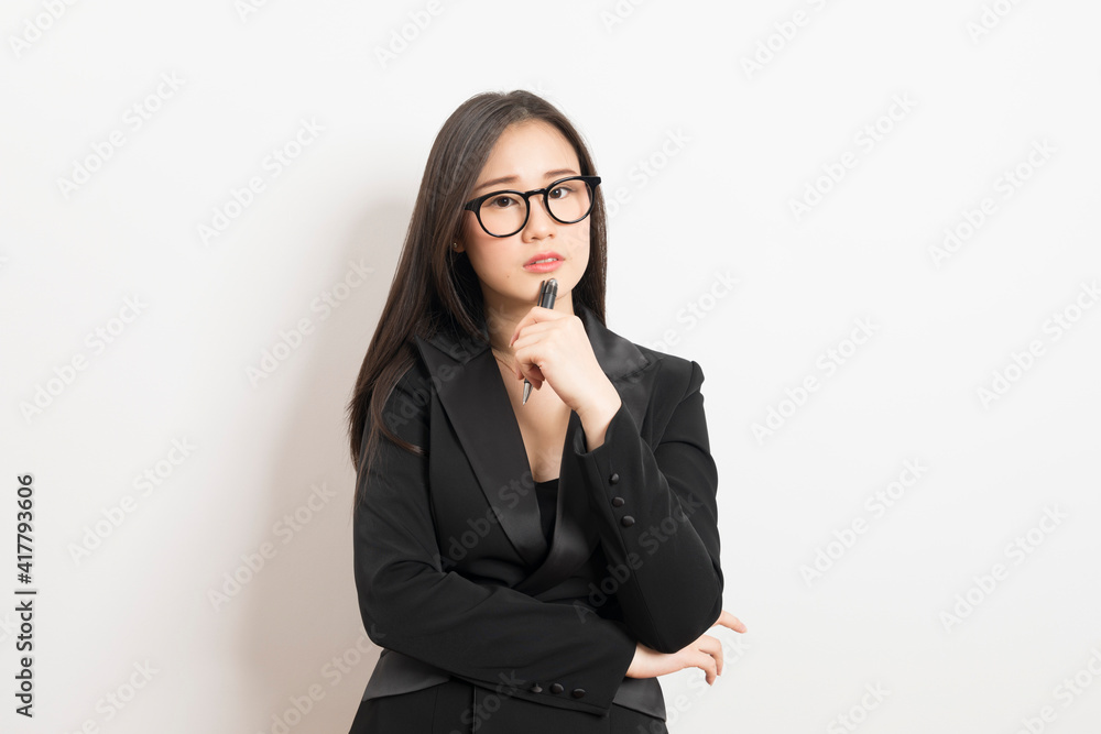 Portrait of Asian woman long hair and wearing suit thinking about success, isolated on white background. Portrait of Asian woman long hair and wearing suit thinking about success, isolated on white background.