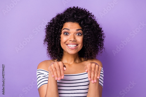 Photo of pretty cheerful dark skin person make arms paws beaming smile isolated on violet color background