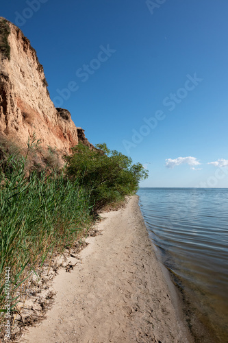 Shore with clay mountains, rocks and hills near the Dnieper estuary and Black Sea. Stanislav, Grand Canyon of Kherson region, Ukraine. Vertical orientation