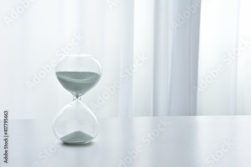 Hourglass on a white desk