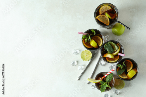 Glasses of Cuba Libre on white textured table